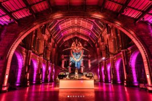 Natural History Museum with modern uplighting next to Dippy