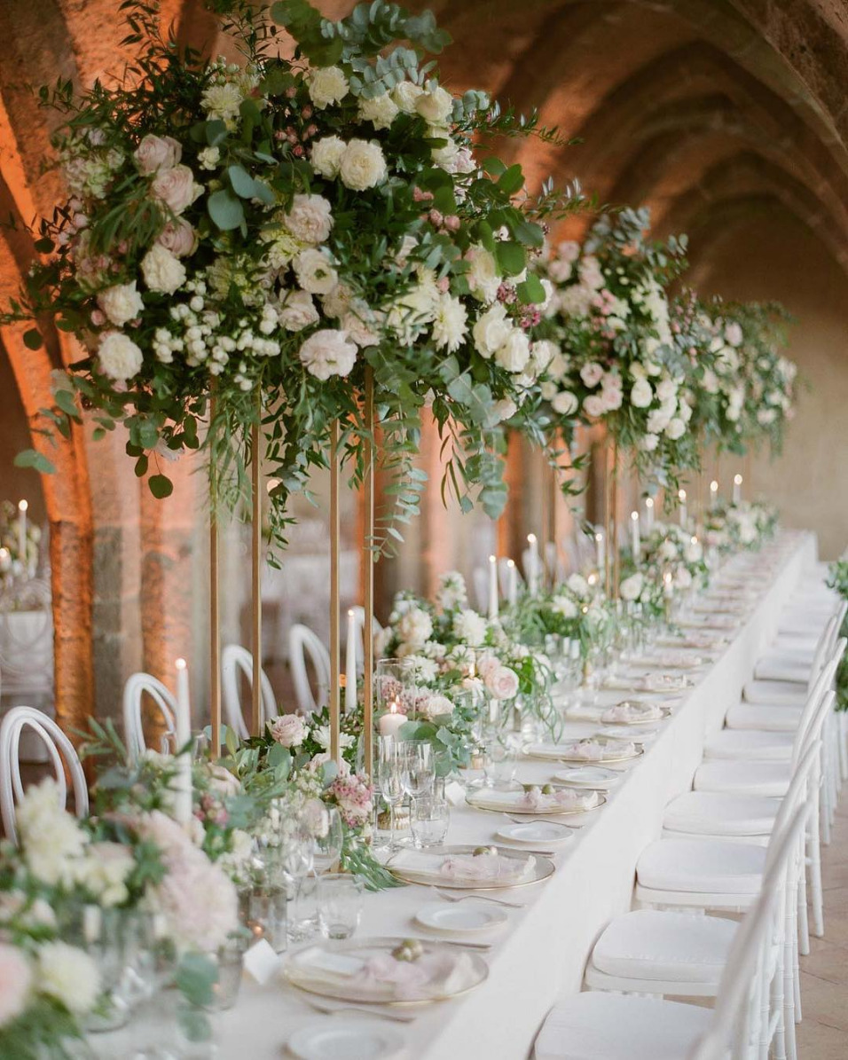 Wedding tablescape with tall flowers and white linen
