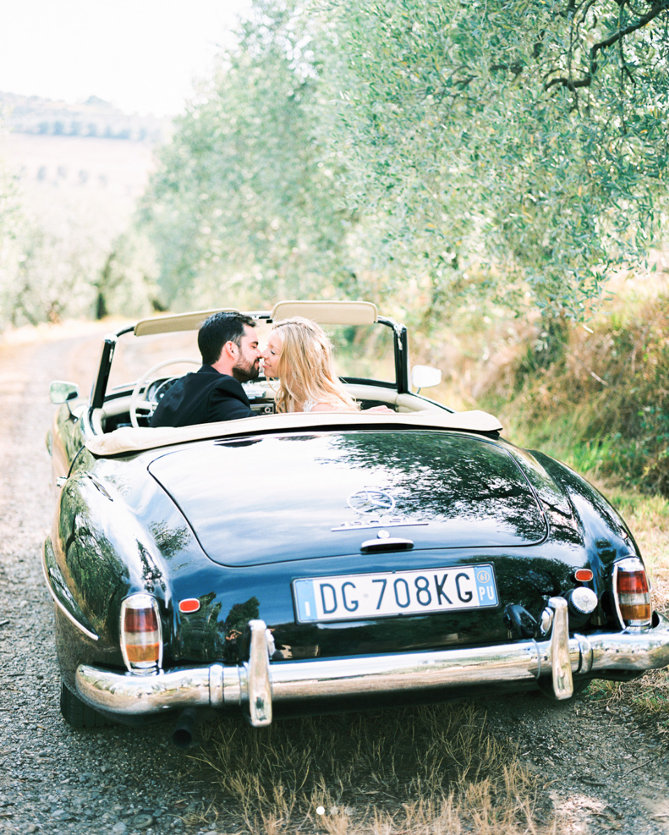 Just married couple driving a classic car in Provence
