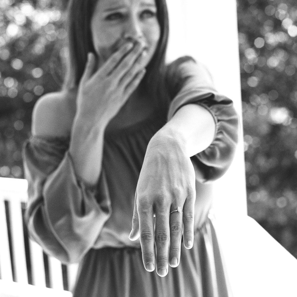 Just engaged bride showing her engagement ring