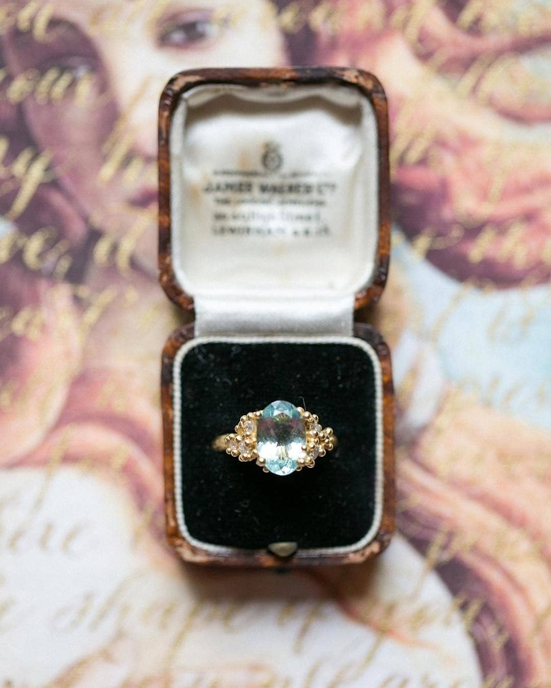 aquamarine engagement ring with gold coral flanking 