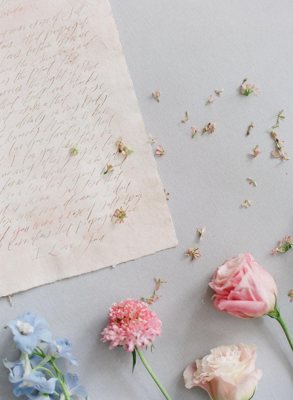 handwritten calligraphy on sepia paper featuring personalized wedding vows
