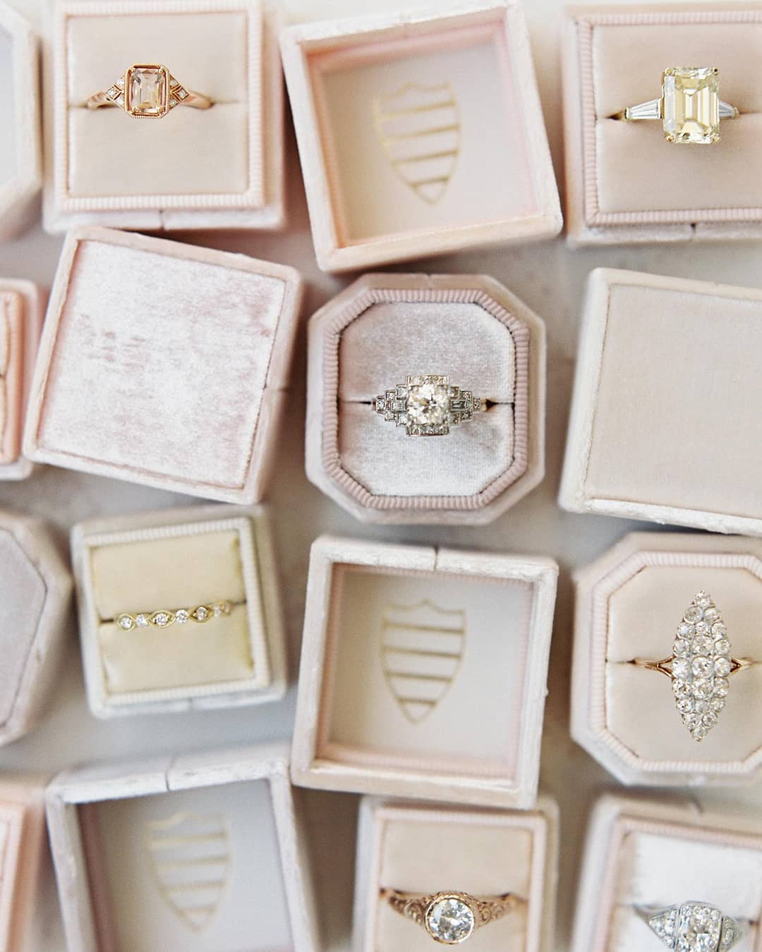 pink velvet ring boxes with mixed vintage engagement rings, captured by film photographer Hannah Alyssa and styled by Willow and Oak Events with ring boxes by The Mrs. Box