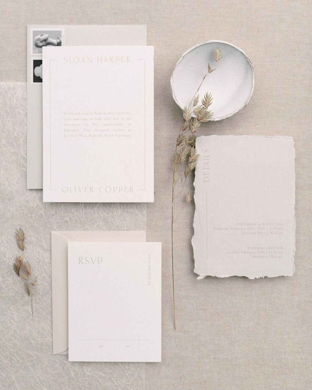 Neutral wedding invitations on deckle edge paper by Dominique Alba with photography by Radian Photography and styling by Wiley Events Co