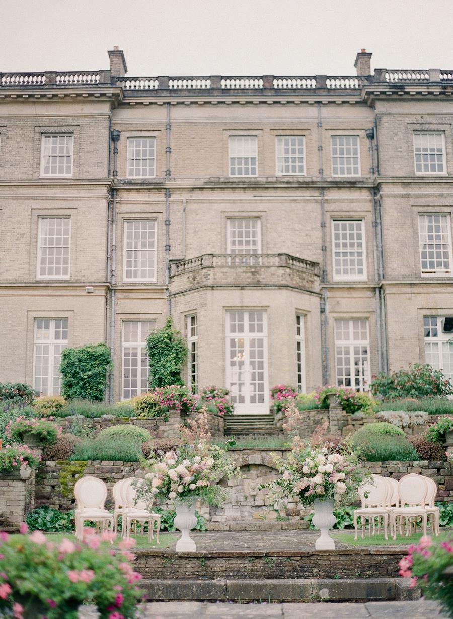 Hedsor House wedding with a pastel color palette, luxury bridal gowns and over-the-top garden flowers || Photo by Julie Livingston with planning + design by Willow and Oak Events