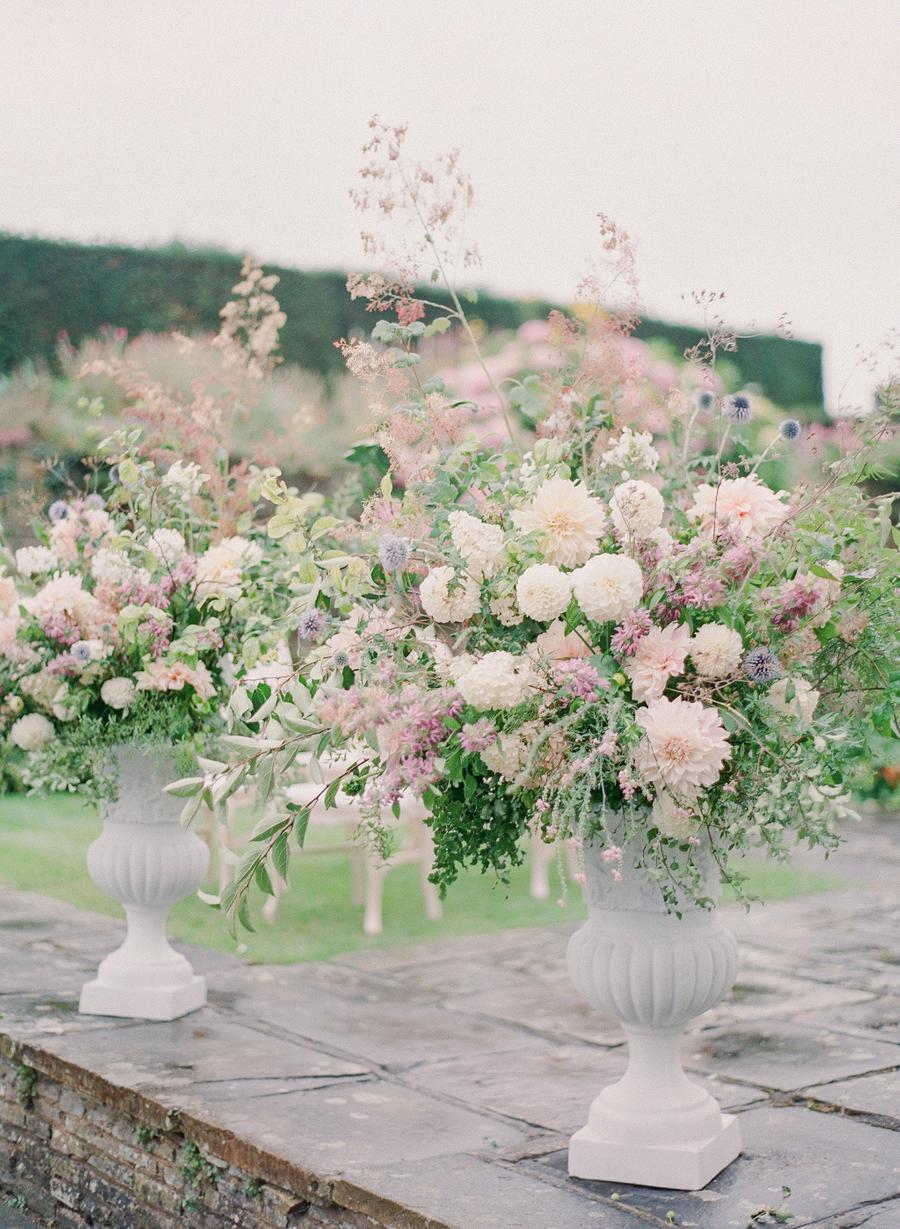 Hedsor House wedding with a pastel color palette, luxury bridal gowns and over-the-top garden flowers || Photo by Julie Livingston with planning + design by Willow and Oak Events