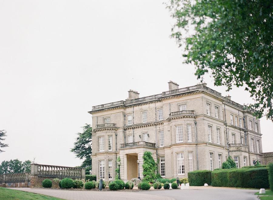 Hedsor House wedding with a pastel color palette, luxury bridal gowns and over-the-top garden flowers || Photo by Julie Livingston with planning + design by Willow and Oak Events