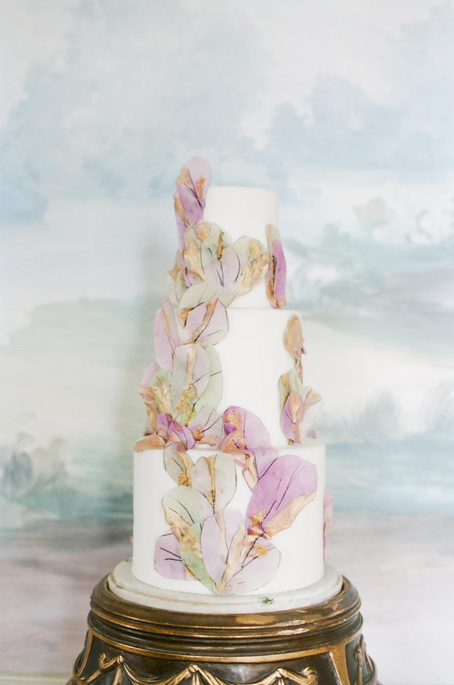 English garden wedding with a rice paper wafer cake, luxury bridal gowns and pastel garden flowers || Photo by Julie Livingston with planning + design by Willow and Oak Events