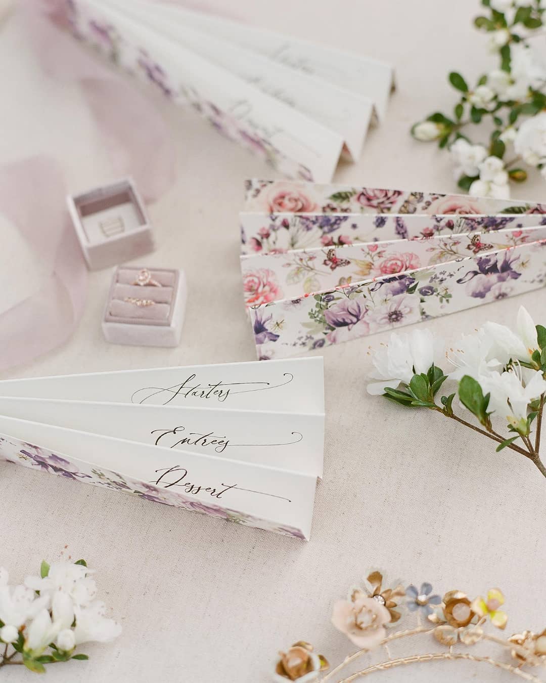Floral printed fan menus with whimsical calligraphy for a spring garden wedding designed by Willow and Oak Events // Photo by The Happy Bloom