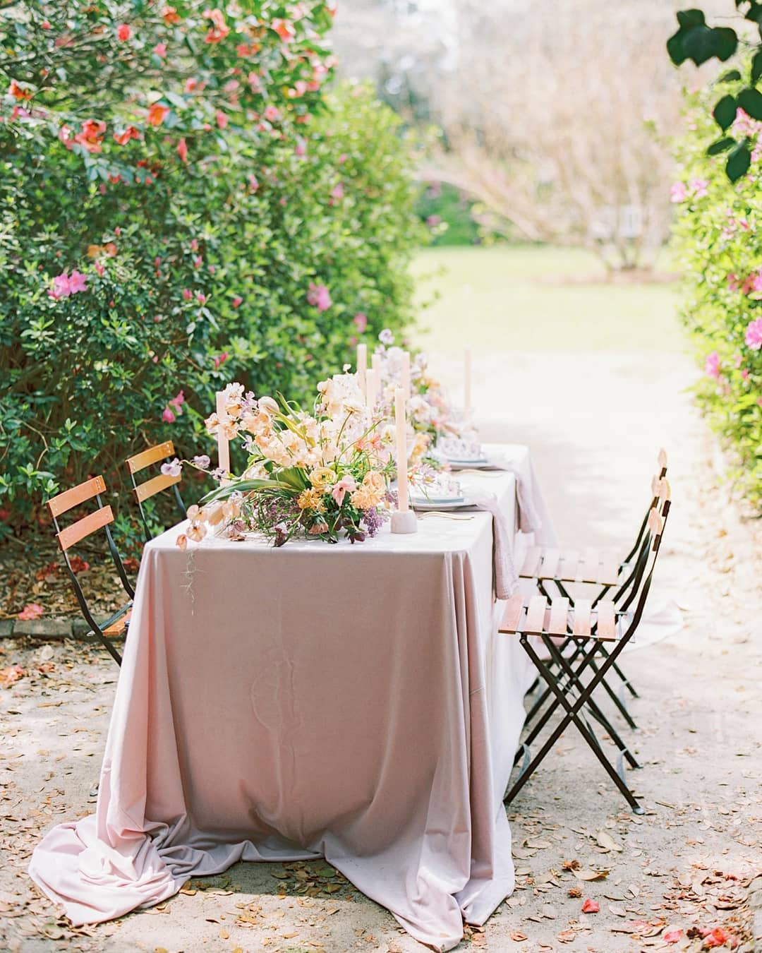 Spring garden wedding with textured candles, ikebana flowers and bistro chairs designed by Willow and Oak Events // Photo by The Happy Bloom
