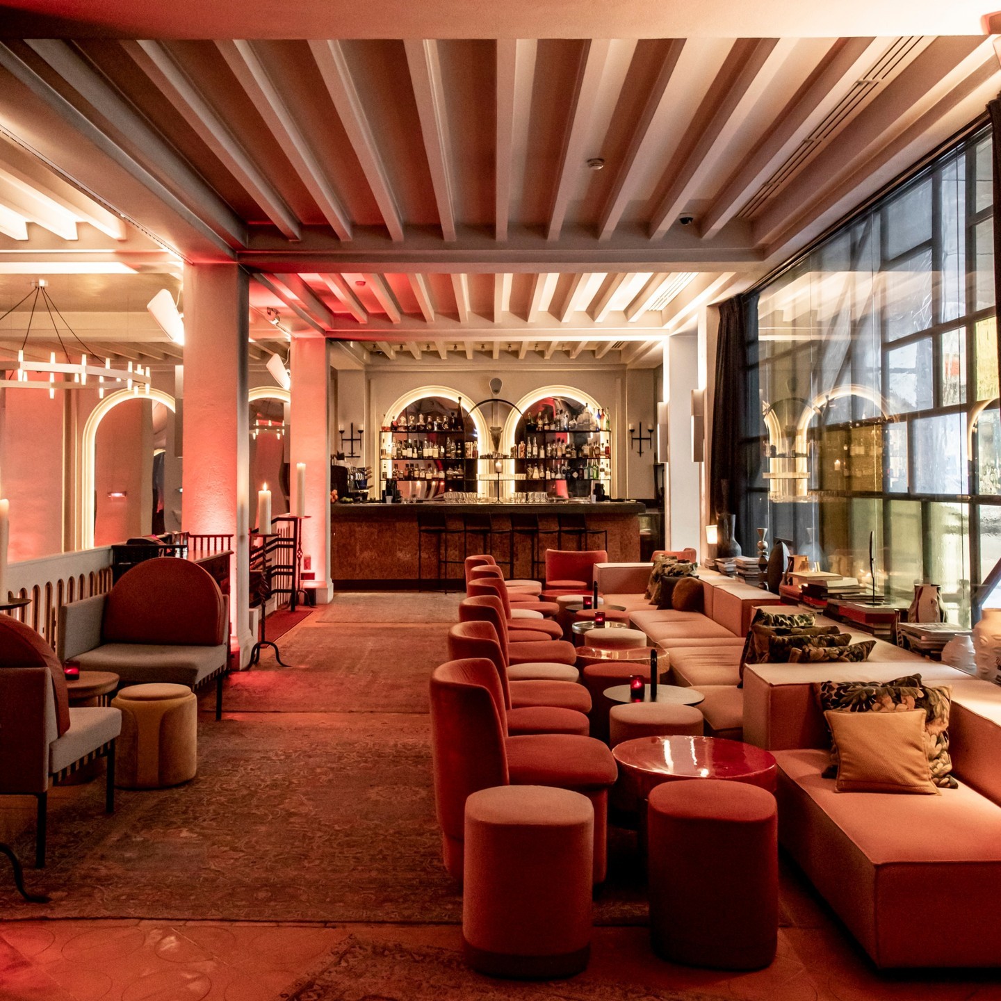 The plush velvet bistro tables, sofas and poufs in the Hotel Sinner Bar