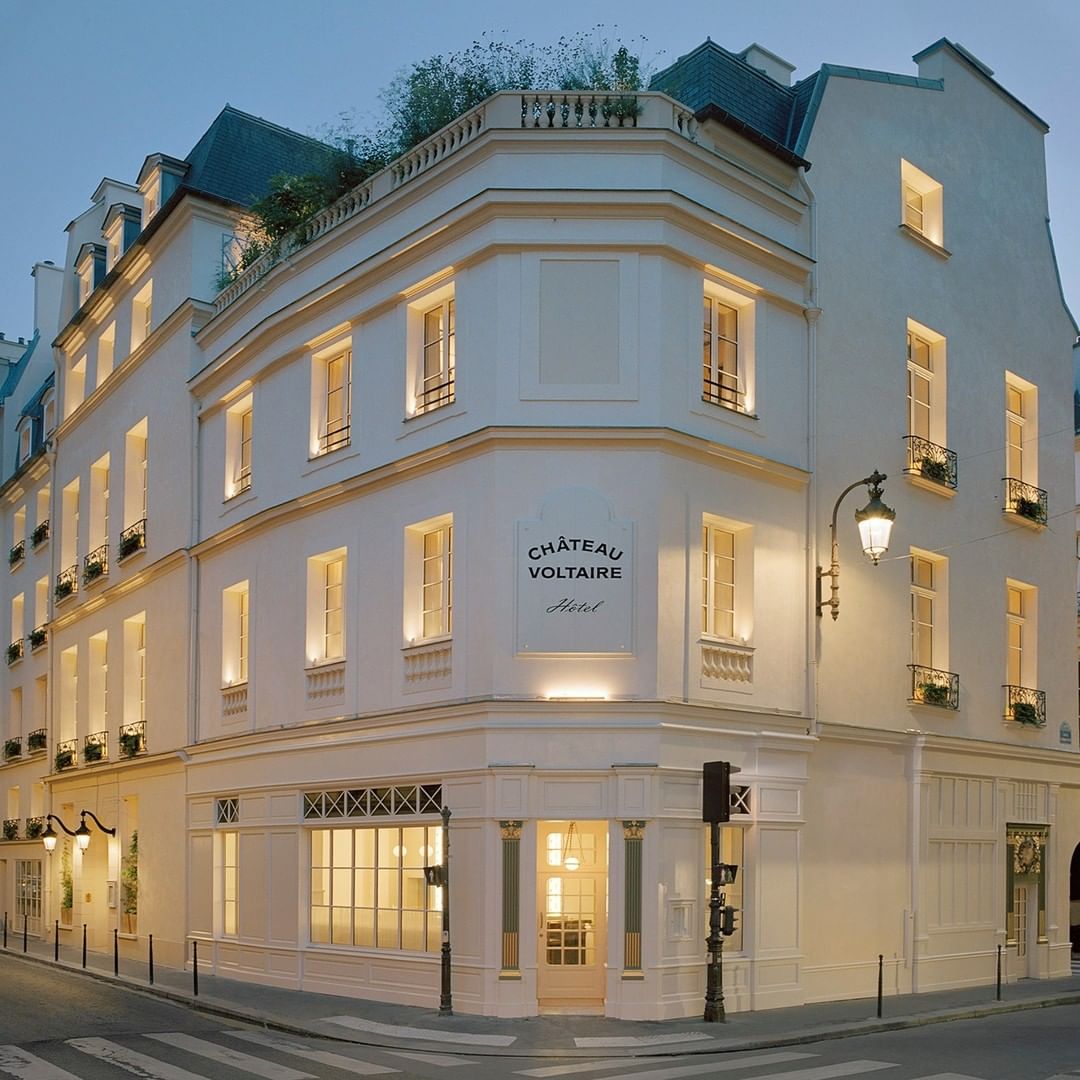The modern white exteriors of Chateau Voltaire that steel feel like classic Parisian architecture