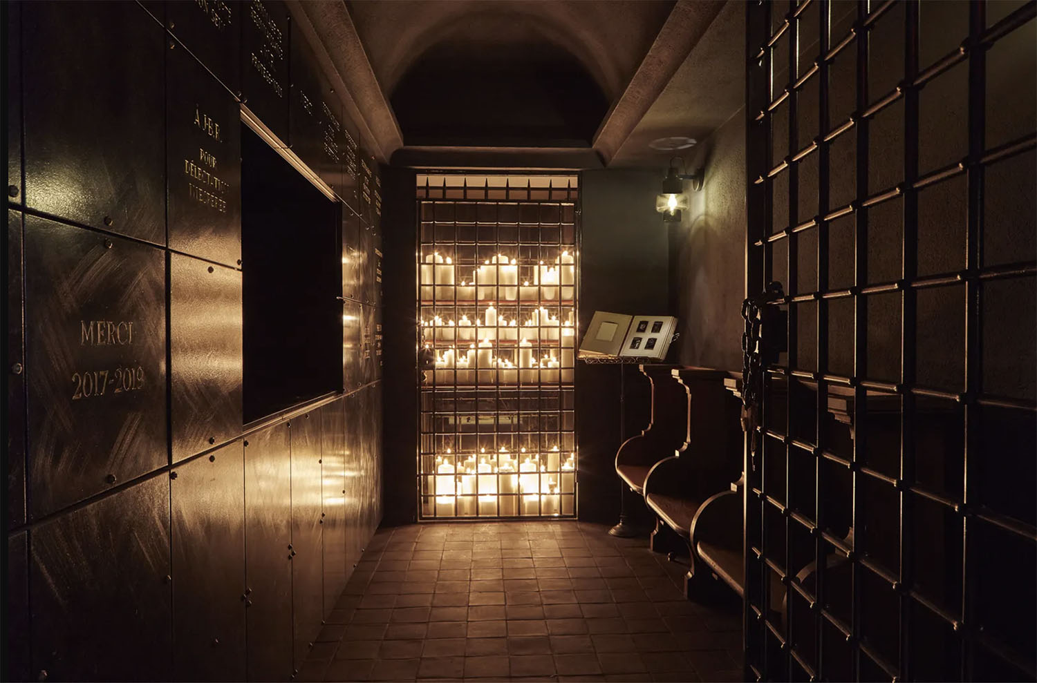 Hundreds of candles in the moody crypt corridor of Hotel Sinner