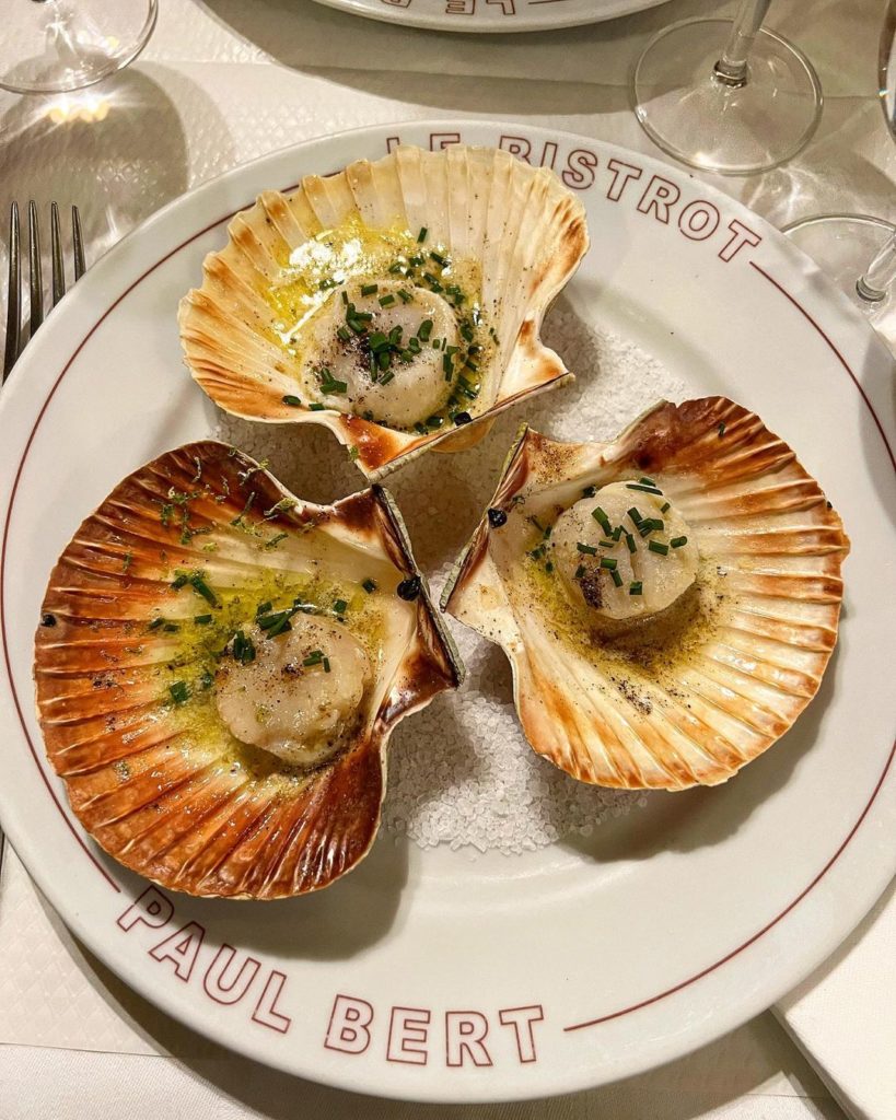 Scallops served in seashells at LE Bistrot Paul Bert