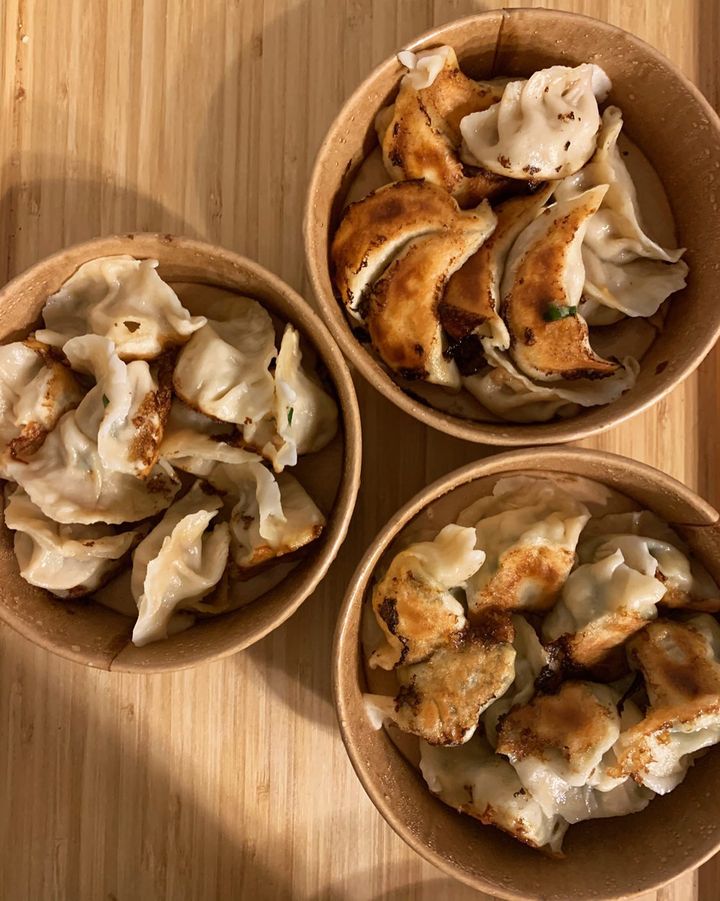 Steamed and fried dumplings in bamboo baskets at Ravioli Nord Est