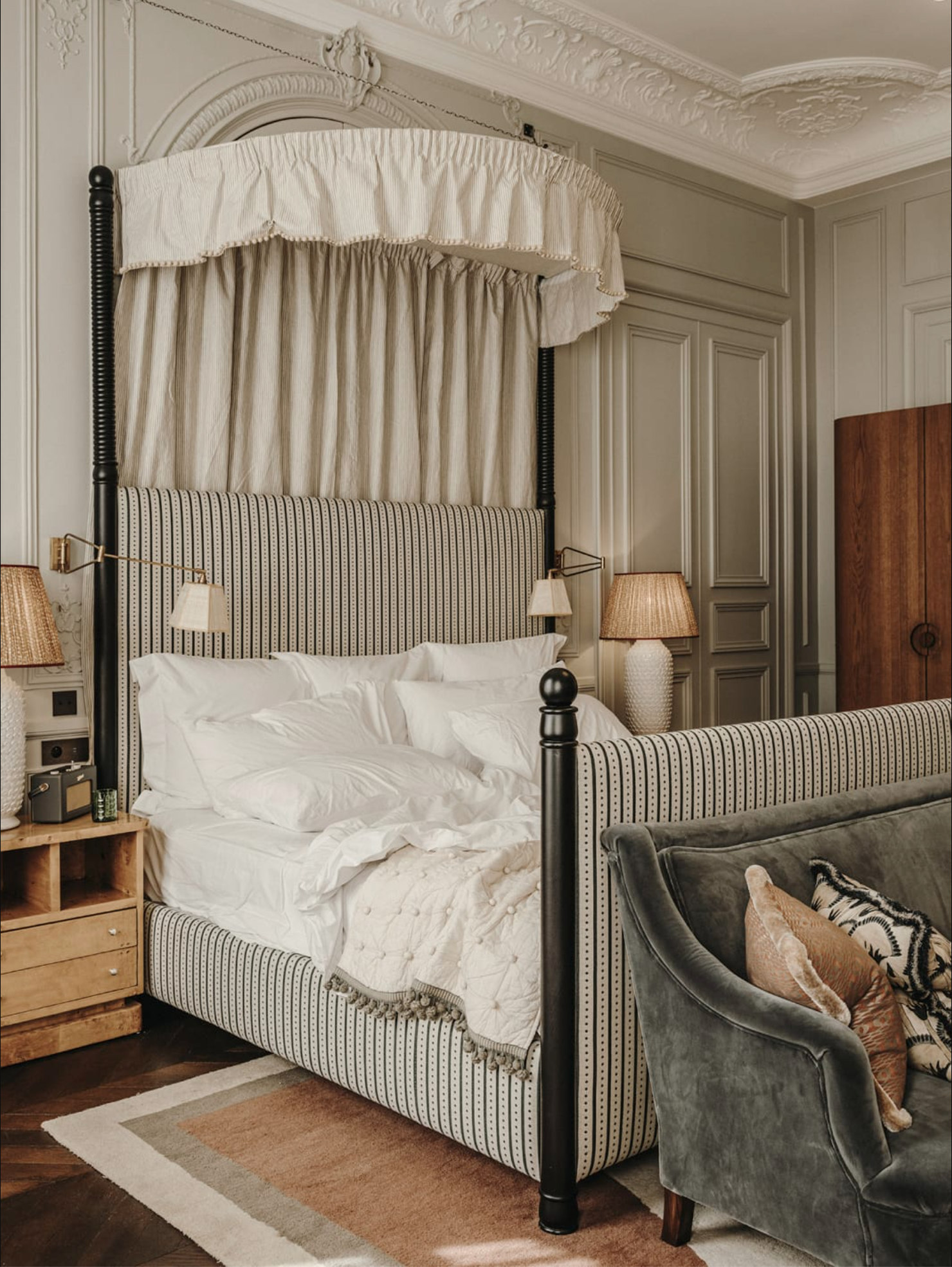 A ticking strip canopy bed at Soho House Paris